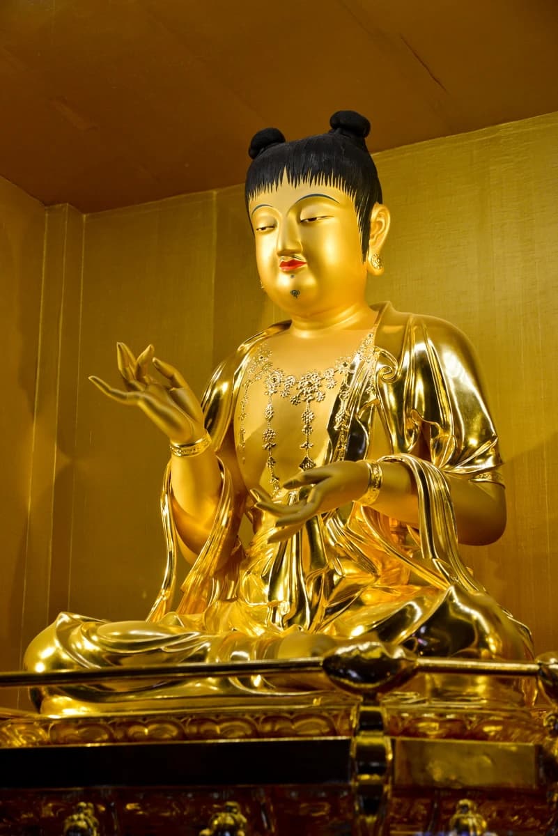 Seated Wooden Manjusri Boy Statue at Sangwonsa Temple